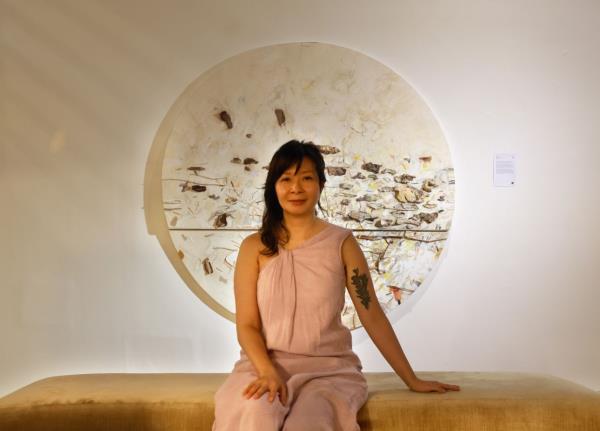 'I see the enviro<em></em>nment as something that shapes who we are,' says Ng, posing in front of a work titled 'Rhythms' at Wei-Ling Gallery in Kuala Lumpur. Photo: The Star/Chan Tak Kong 