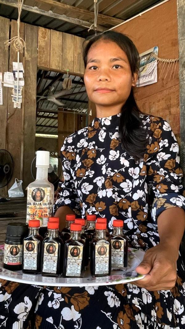 Nur Rafidah Man with some of the products she sells on Tik Tok. 