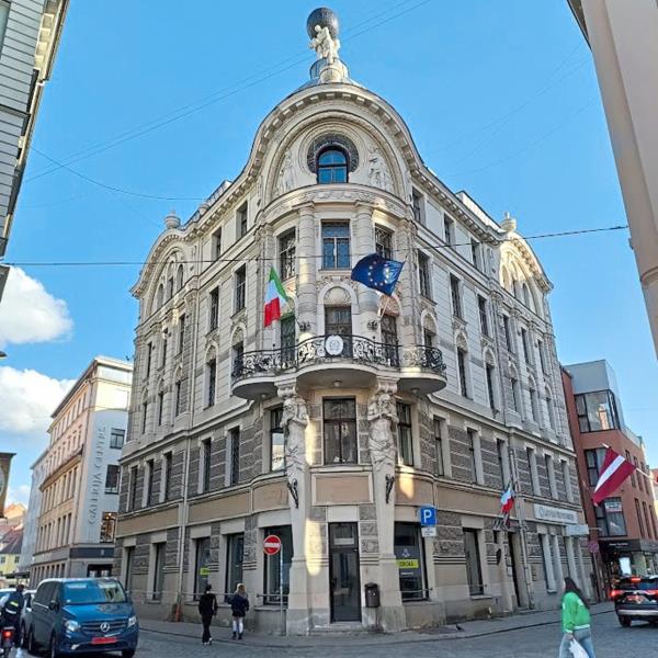 Mythological figures adorn an Art Nouveau building.