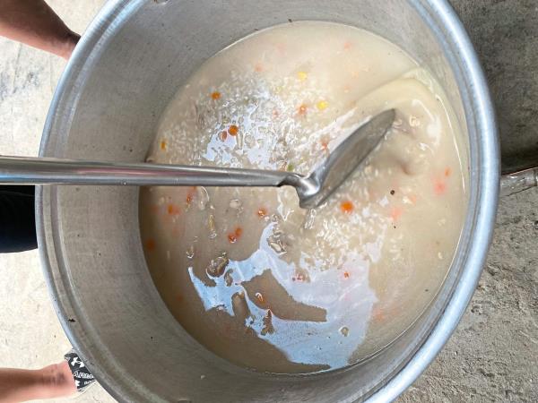 The bubur lambuk being stirred.