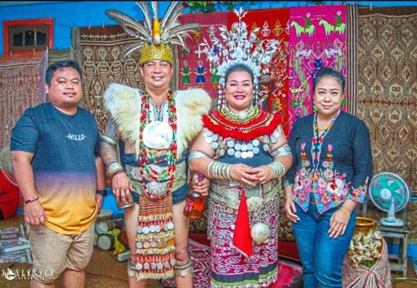 Nora (right) and traditio<em></em>nal outfit specialist Louis Wessly (left) at an Iban wedding in Danau, Kalimantan in Indonesia.