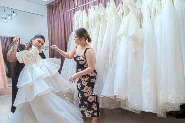 Behind the scenes: Angelinatasia (left) and Arabella (right) work as a team to build the bridal business their mum started.