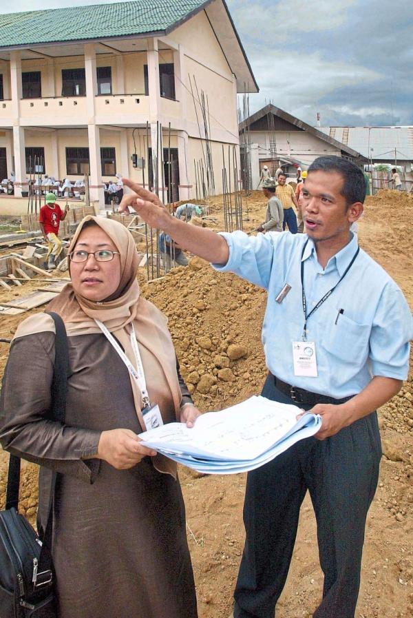 Dr Jemilah and Aceh operations head, architect Norazam Abu Samah at the site of the new pharmacy academy that Mercy Malaysia helped set up. Photo: Filepic