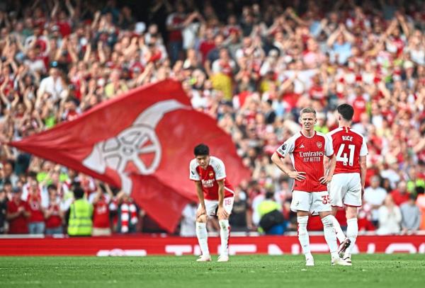 Arsenal’s Takehiro Tomiyasu, Declan Rice and Oleksandr Zinchenko react after the match. The Gunners finished second. — Reuters