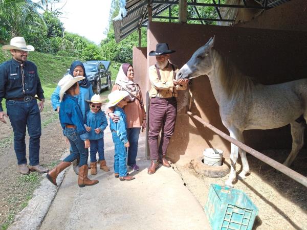 The cowboy family at their family farm.