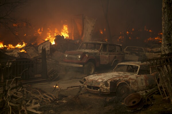 Vehicles sit destroyed after the Airport Fire swept through Tuesday, Sept. 10, 2024, in El Cariso, an unincorporated community in Riverside County, Calif. (AP Photo/Eric Thayer)