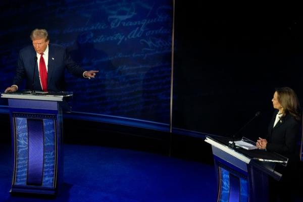 Republican presidential nominee former President Do<em></em>nald Trump and Democratic presidential nominee Vice President Kamala Harris participate during an ABC News presidential debate at the Natio<em></em>nal Co<em></em>nstitution Center on Tuesday in Philadelphia.