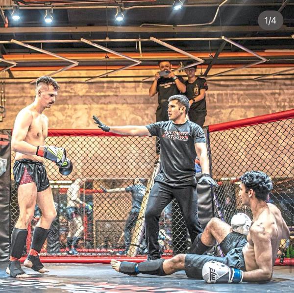 Chee (centre) says MMA is like a ‘rapid chess game’ wher<em></em>e you need to be able to ‘think five to 10 steps ahead of your opponent’. Photo: Instagram/Dan Chee