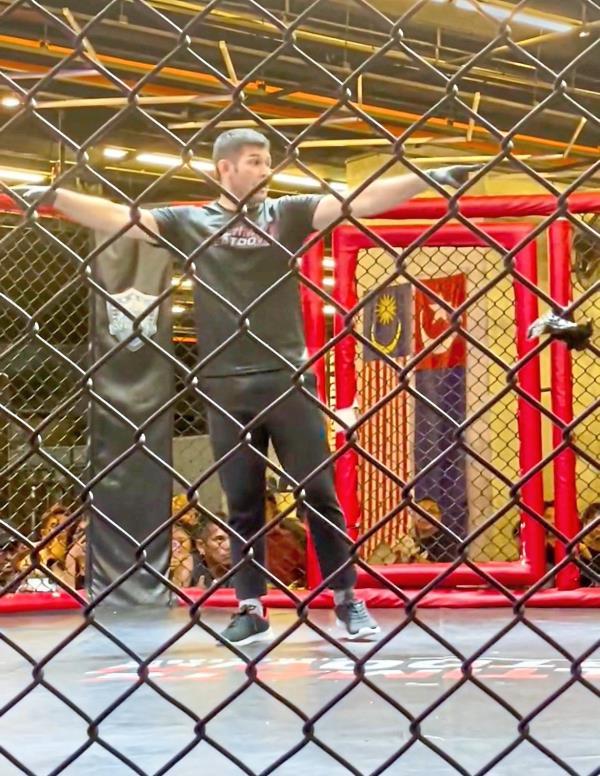 Chee at The Cage, a fight venue. Photo: Instagram/Dan Chee