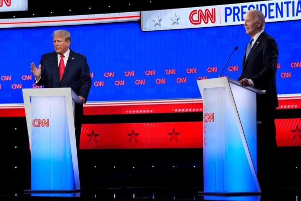 President Ro<em></em>nald Reagan and his Democratic challenger Walter Mondale, shake hands before debating.